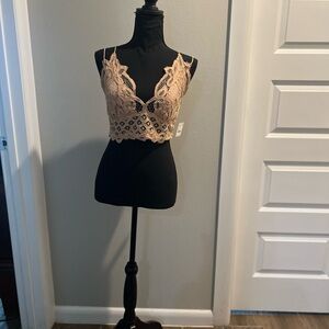 Free People camisole/bra size XL . Cotton with embroidery lace and thin straps.